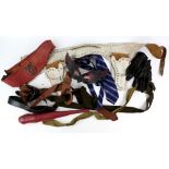 Movie props and costumes including vintage belts, gloves, leather boots, shoes, patches, badges, and