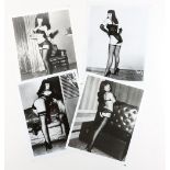 Bettie Page four black and white film stills, 10 x 8 inches (4)..