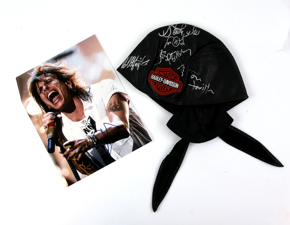 Aerosmith - Leather Harley Davidson cap signed by Steve Tyler, Joe Perry, Tom Hamilton, Joe Kramer