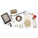 Group of costume jewellery, including silver ingot pendant, two silver charms bracelets with