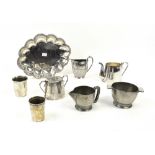 Silver topped cut glass perfume bottle, silver mug, two ashtrays toast rack and other silver and