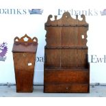 A 19th century oak pipe stand, having fretwork above racks, compartment and single drawer, with an