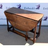 Oak drop-leaf gateleg table, short drawer to side, on bobbin turned supports, 79 x 98cm.