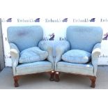 Pair of early 20th century armchairs, blue floral upholstery and scroll arms, on scrolling foliate