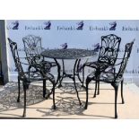 Circular garden table and four matching chairs . This set is not cast iron, painted metalGeneral