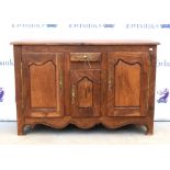 20th century oak dresser base, with short drawer and three cupboard doors, on bracket feet, 88 x 135