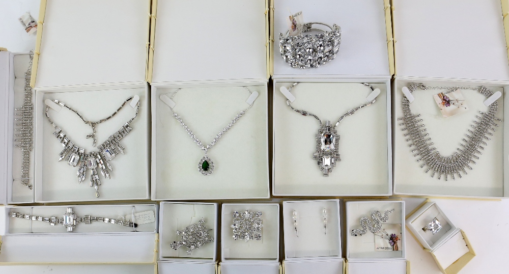 A group of fashion jewellery, boxed and unworn including bangles, rings, tortoise brooch, many items