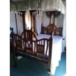 Early 20th century mahogany bed with cloth panel to top, the headboard and footboard inset with