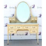 Cream painted dressing table, oval mirror and two short drawers above single long drawer and two