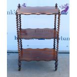 19th century rosewood three tier whatnot, with barley twist supports, raised on castors, 83 x 51 x