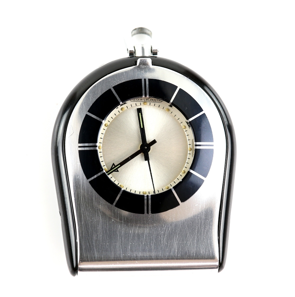 Jaeger Le Coultre travel alarm clock, in a hinged stainless steel case, with black enamel bezel