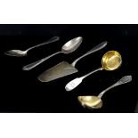 Selection of silver-plated flatware to include serving spoons and a small cake slice, along with a