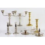 Selection of silver-plated items including a pair of candelabra, toast rack, wine bottle coasters,