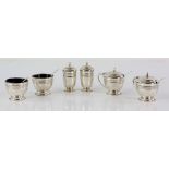 Modern silver cruet set comprising two each of mustard pots, open salts, pepperettes, mustard spoons