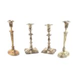 Pair of silver-plated candlesticks, on oval reeded bases and stems, 27cm high and another pair in