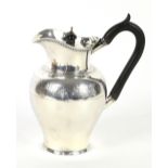 Victorian silver jug, the baluster body with chased foliate band and everted lip, by Henry Gee &