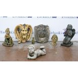 Group of composite stone garden items to include Lion mask 45cm x 42cm, cherub lying on belly 45cm