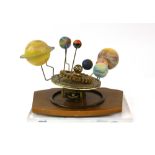 Model Orrery with mechanical movement mounted on wooden plaque and Perspex base, H16.5 x W21 x D15cm