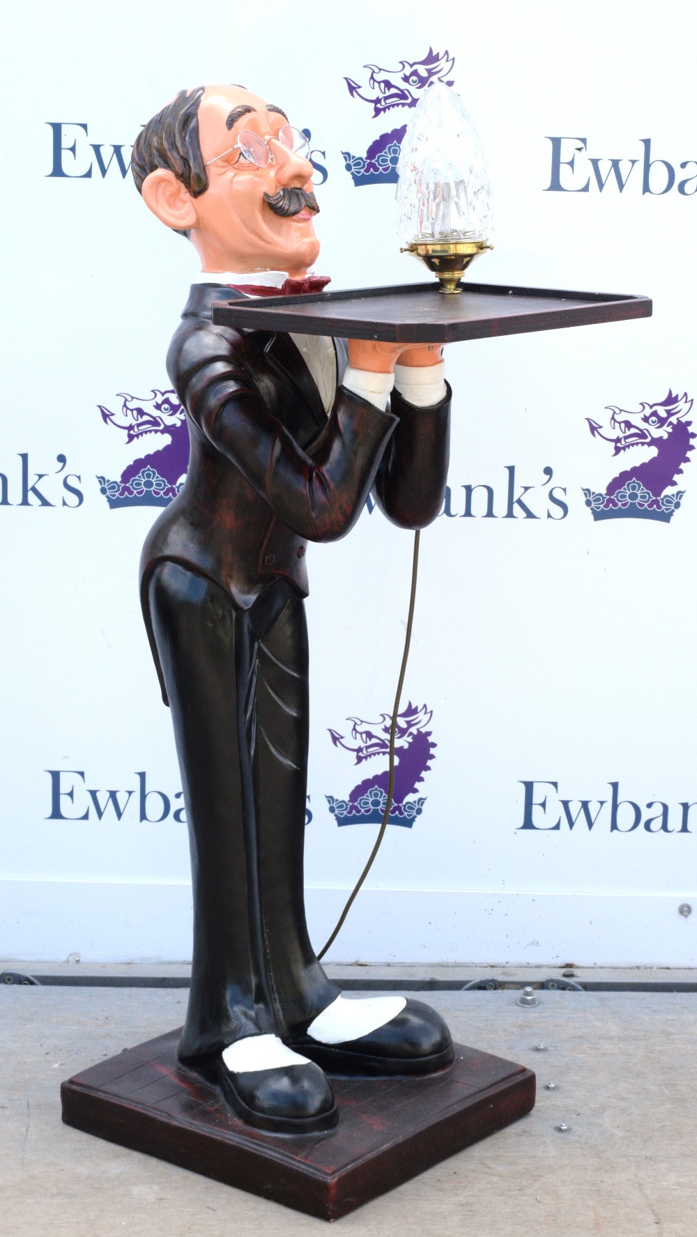 Novelty dumb waiter, modelled as a male figure carrying a tray and lamp, 109 cm high Lamp slightly - Image 2 of 2