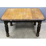 Oak dining table with floral carved rim on floral carved legs, 68 x 122 x 104cm Numerous drilled