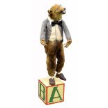 Taxidermy automaton of a Fox in clothes standing atop a box painted with letters, H.112cm PAT