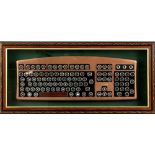 Collection of framed objects to include, solid silver medallion, framed computer keyboard, key, star