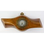 A propeller clock, the cut-down wooden propeller boss mounted to centre with Smith rear winding