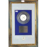Pet Shop Boys - Silver disc presented to Jan Brooks to recognise sales in the United Kingdom of more