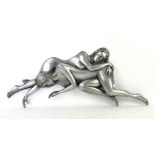 Compulsion Gallery pewter coated resin wall art plaque of two entwined nude ladies, length 74cm.