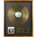 Beatles - RIAA Capitol gold disc for Sgt. Pepper's Lonely Hearts Club Band. A mounted and framed