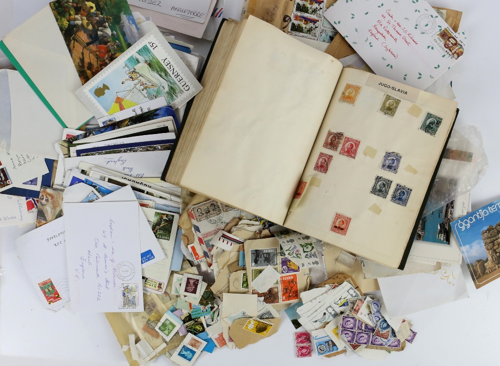 Album of World Stamps together with loose in envelopes, packets and various commercial