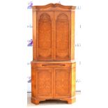 Reproduction burr walnut veneer corner drinks cabinet, two doors above brush slide and two