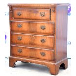 Reproduction mahogany bachelor's chest with fold over top, and four long drawers on bracket feet,
