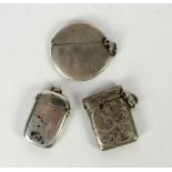 Three silver vesta cases including an oval example, Birmingham 1901, Sheffield 1898 and Chester 1907