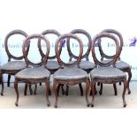 Set of seven late 19th century mahogany dining chairs with horsehair stuffed seats on cabriole