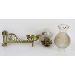 Gothic style brass hinged wall mounted oil lamp with glass reservoir and shade, pair of swinging