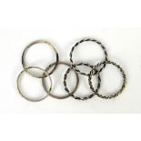 Cased set of six Danish silver napkin rings in six designs by Uwe Moltke
