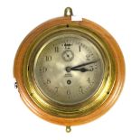 Brass cased bulkhead clock, the 6.5 inch silvered dial with Roman numerals signed Barkers,