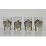 Set of four silver- sleeved cups with puttis and highly embossed decoration, Berthold Muller