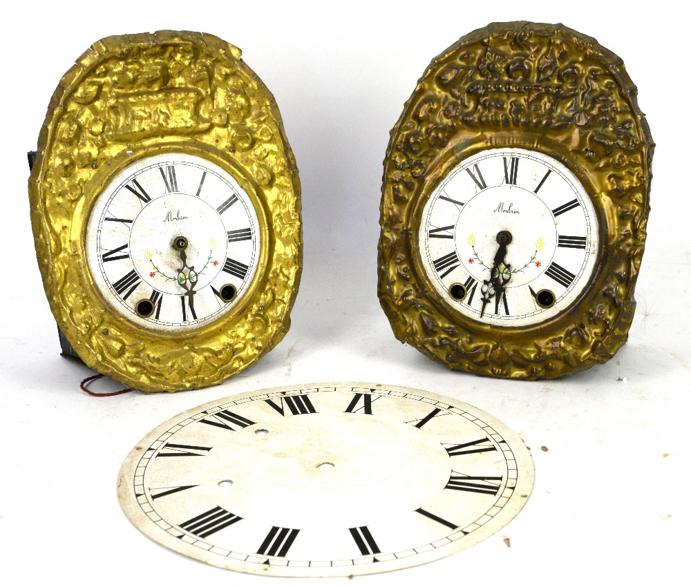 Two wall clocks, together with a wall clock movement, two Comtoise clocks and a round clock dial