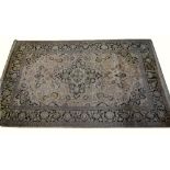 Silk Kashmir carpet central floral design, 292cm x 184cm In need of a clean. Worn almost through