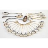 Selection of silver-plated flatware to include soup spoons and a ladle