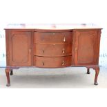 20th century mahogany sideboard, with three bowfronted drawers flanked by cupboard doors, on