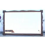 Late 19th century oak wall mirror, with bevelled glass plate and shaped frame, 75 x 46.5cm