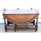 AMENDED DESCRIPTION - 19th century oak gateleg table, the top with carved scrolling foliate