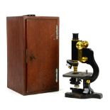 American cased brass mounted microscope by Spencer Lens Co, Buffalo, NY with three spare lenses, the