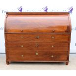 19th century mahogany cylinder bureau, the cover enclosing central cupboard with figural inlaid