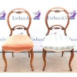 Pair of 19th century dining chairs with C-scroll carving to backrests One of the chairs is broken to
