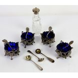 Set of four silver plated table salts with blue glass liners, set of four Victorian silver flower
