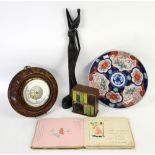Autograph book with illustrations and pictures, a desk tidy in the form of a bookshelf, a Balinese